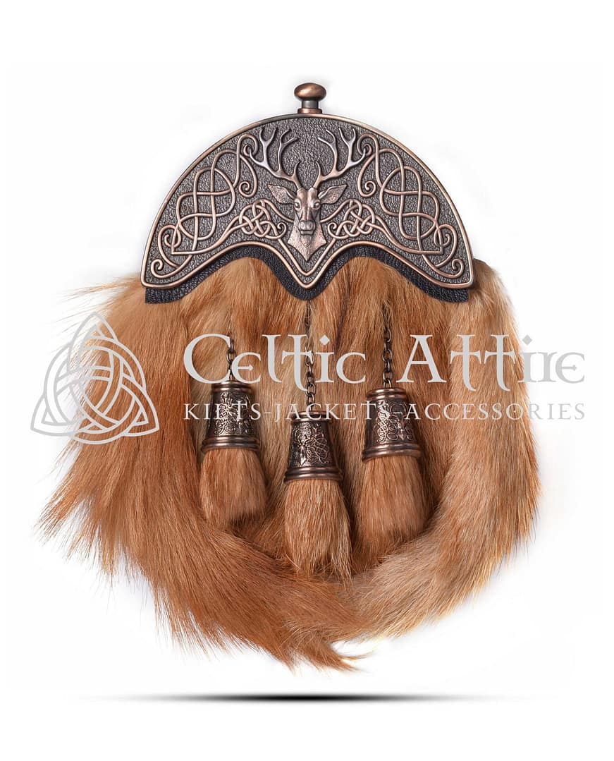 The Fox Fur Dress Sporran is a luxurious accessory that adds a touch of elegance to any Highland outfit. Made from premium red fox fur, this sporran features a striking bronze stag head cantle, symbolizing strength and tradition. Its rich colors and soft texture make it a standout piece for formal occasions. Handcrafted in Scotland by skilled artisans, this sporran showcases exceptional craftsmanship. The natural beauty of the fox fur is complemented by the antique finish of the stag head cantle, creating a unique and eye-catching design. This Fox Fur Dress Sporran is perfect for weddings, Highland games, or any special event where you want to make an impression. Functionality meets style with this sporran. It offers ample storage space for your essentials, ensuring you have everything you need at hand. The interior is lined with soft suede and includes pockets for cards and coins. A durable leather back enhances its longevity, making it a reliable choice for any occasion. The Fox Fur Dress Sporran comes with a matching chain strap for easy attachment to your kilt. Three elegant tassels hang from the front, adding a classic touch that enhances its overall aesthetic. This sporran is designed to pair beautifully with various kilts and formal wear, making it a versatile addition to your wardrobe. Invest in the Fox Fur Dress Sporran to celebrate your connection to Scottish heritage while showcasing your unique style. This exquisite accessory is more than just a sporran; it’s a statement piece that reflects your appreciation for quality and tradition. Make a lasting impression at your next event with this stunning sporran.